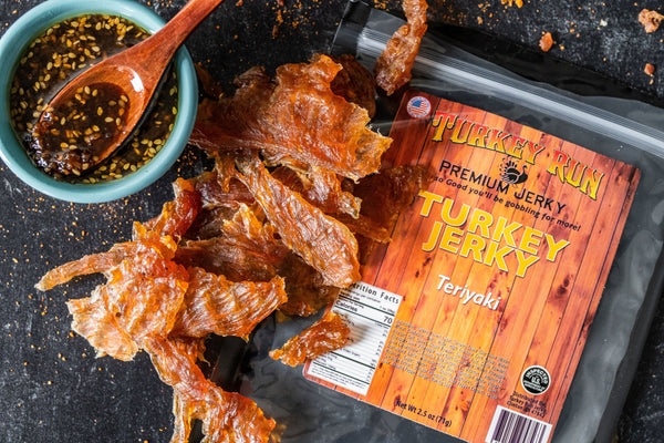 A photo showcasing our Teriyaki flavored Turkey Jerky with seasonings