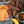Load image into Gallery viewer, Brisket Beef Jerky photo showing Peppered Orange Teriyaki Flavored with seasonings and orange slices
